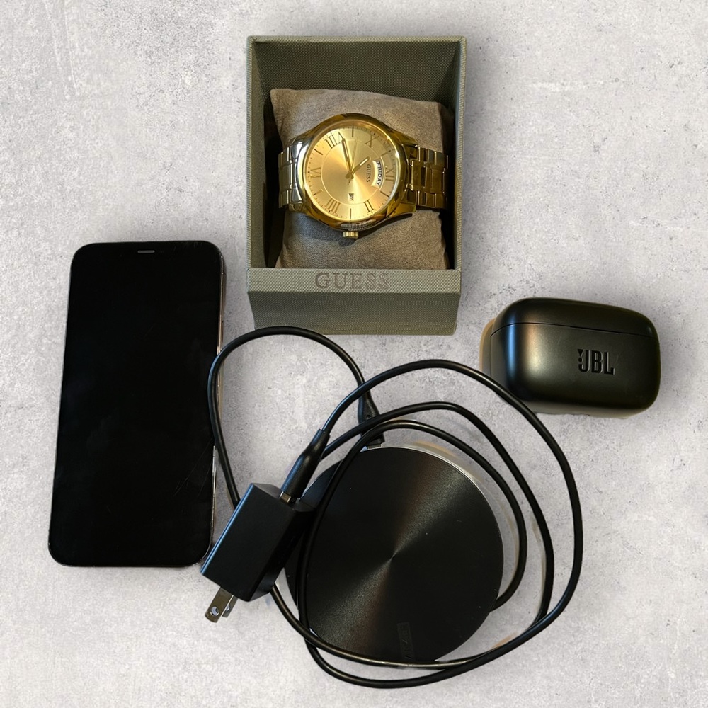 iPhone 12 PRO, JBL wireless earphones, GUESS Gold Watch, and Wireless charger.